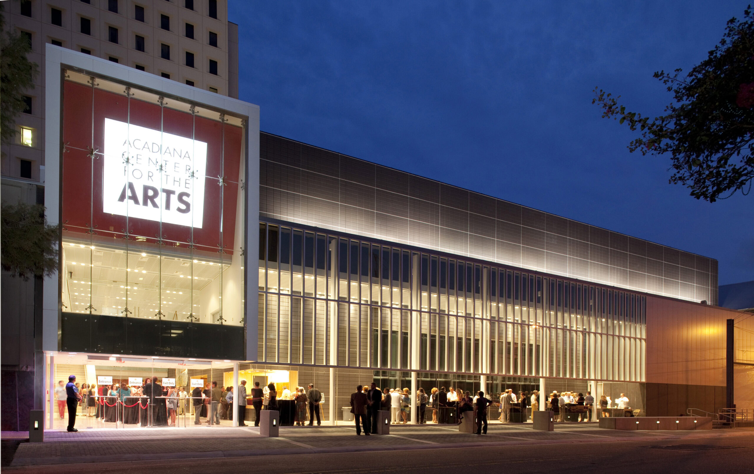 Acadiana Center for the Arts in Lafayette, cultural events, modern arts, community gathering, Louisiana arts, entertainment venue, architectural design, night lighting, event space.