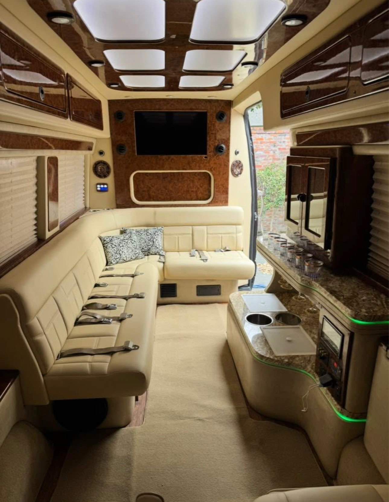 Luxury limousine interior with plush seating, modern amenities, and entertainment system for upscale transportation services.