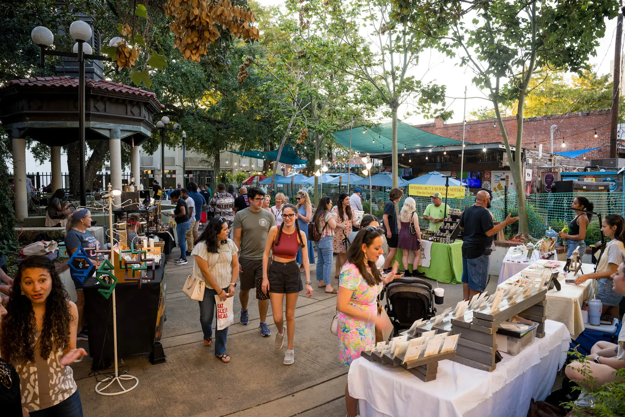 Explore Bayou State Operations' outdoor market scene in Acadiana, featuring local vendors, community gathering, and vibrant local culture for new residents.